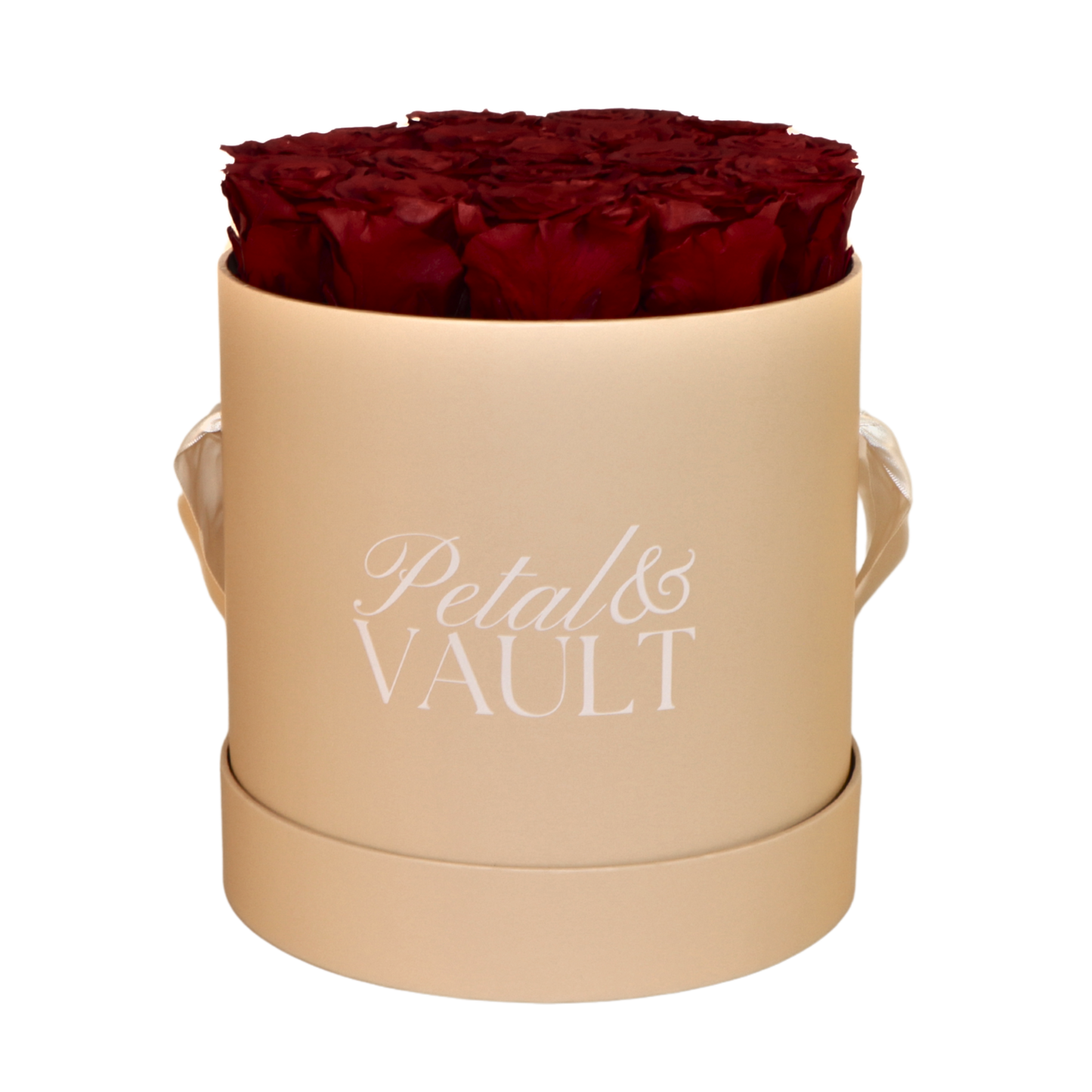 Beige cylindrical hat box with red roses and 'Petal & Vault' branding on a white background