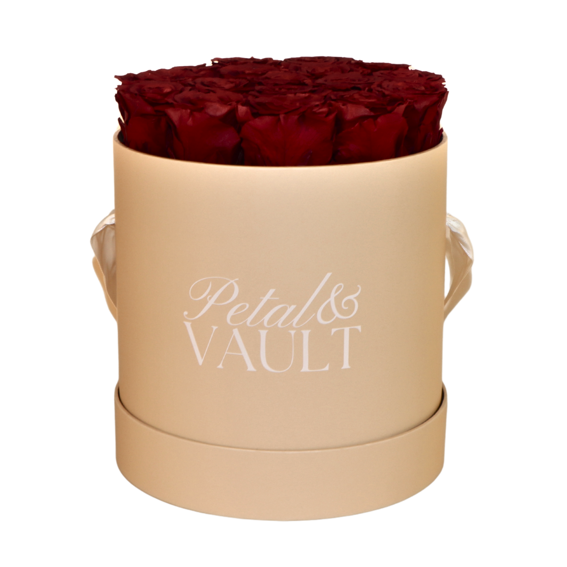 Beige cylindrical hat box with red roses and 'Petal & Vault' branding on a white background